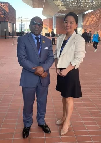 CTXcarbonAuction - 1EarthMedia Malawi Vice President Honorable Michael Usi with Gold Standard CEO Margaret Kim at COP28 Dubai (Photo: Business Wire)