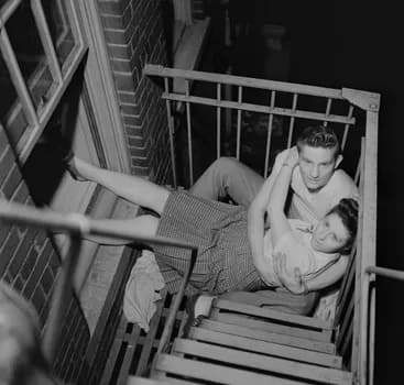 Stanley Kubrick's Park Benches - Love is Everywhere [Couple flirting on a fire escape], 1946.