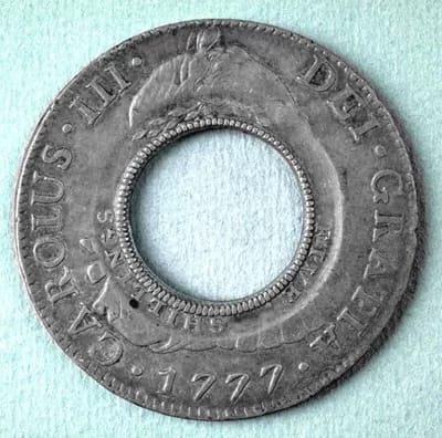 AFPholeydollar02 - 1EarthMedia Stolen 1813 Holey Dollar