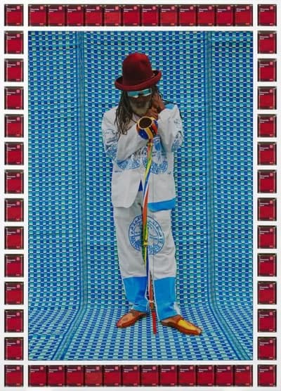 Hassan - 1EarthMedia Hassan Hajjaj Master Cobra Mansa 2013 metallic inkjet print, timber frame, cans 76.2 x 111.8 cm (image); 95.0 x 135.0 x 7.0 cm (framed) National Gallery of Victoria, Melbourne Orloff Family Charitable Trust, 2019 © Hassan Hajjaj Photo: Predrag Cancar / NGV