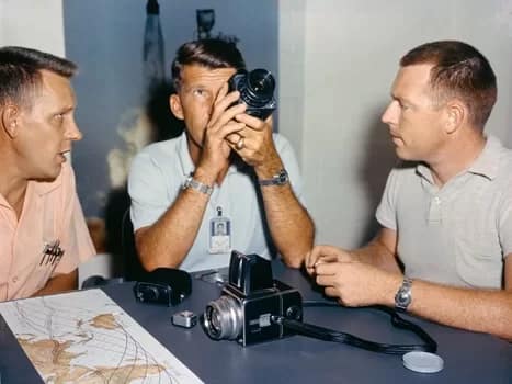 Hasselblad010-350 - 1EarthMedia Astronaut Walter "Wally" Schirra, center, with his Hasselblad