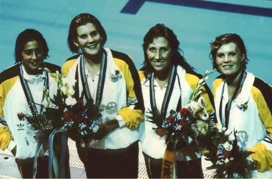 Hayley Lewis, Jennifer McMahon, Janelle Elford and Julie McDonald - 1EarthMedia Australian Gold Medallists from left, Hayley Lewis, Jennifer McMahon, Janelle Elford and Julie McDonald poolside after receiving their Gold Medals for the Women's 4 x 200m Freestyle Relay