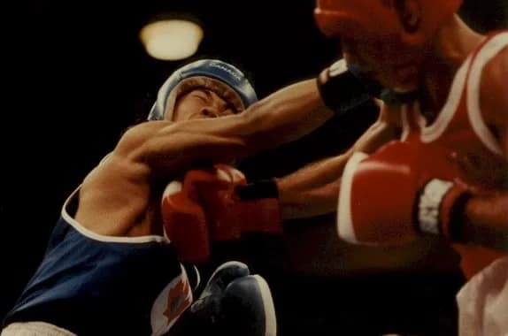 Graham Cheney lands a right on an opponent during Welterweight competition