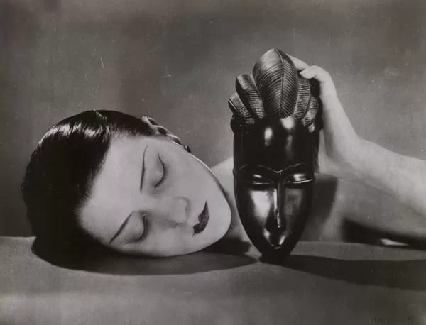 ManRay600 - 1EarthMedia Man Ray, Kiki with African mask, 1926 gelatin silver photograph 21.1 x 27.6 cm (image); 22.1 x 28.5 cm (sheet) National Gallery of Victoria, Melbourne Purchased through The Art Foundation of Victoria with the assistance of Miss Flora MacDonald Anderson and Mrs Ethel Elizabeth Ogilvy Lumsden, Founder Benefactors, 1983 © MAN RAY TRUST / ADAGP, Paris. Licensed by Copyright Agency, Australia Photo: Helen Oliver-Skuse / NGV
