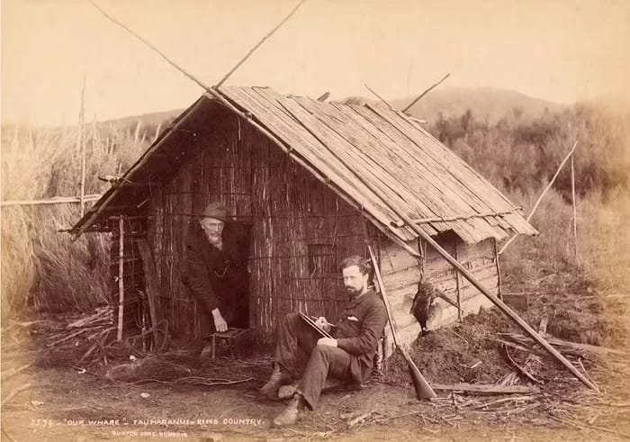 landscapephotography010-700 - 1EarthMedia Burton and Payton are pictured here outside a whare in Taumaranui, near the centre of the King Country. Alfred Burton, Burton Brothers Studio, Photography Collection, Museum of New Zealand Te Papa Tongarewa