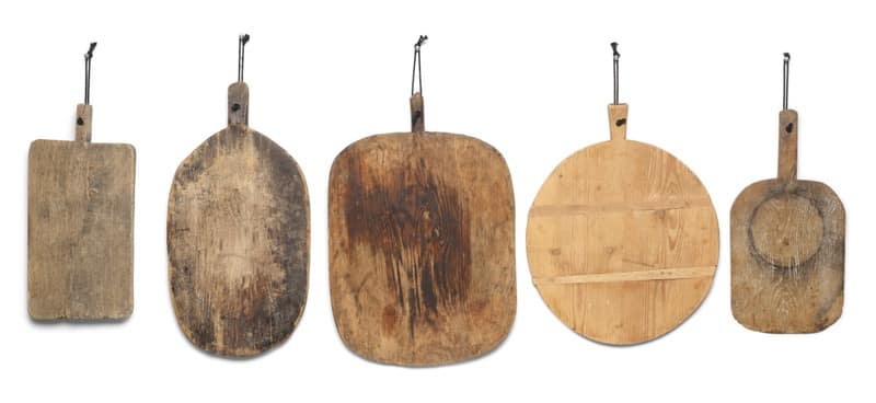 Suggested objection to registration of “Free Palestine” Five wooden cutting boards of varying shapes hanging by cords, lined up from left to right—a rectangular board, two oval/rounded boards, a circular-board with slats, and a small rounded square board.