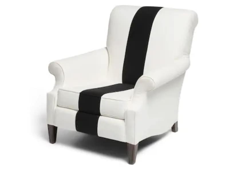 Diane Keaton Chair - 1EarthMedia White upholstered armchair with a black vertical stripe down the center.