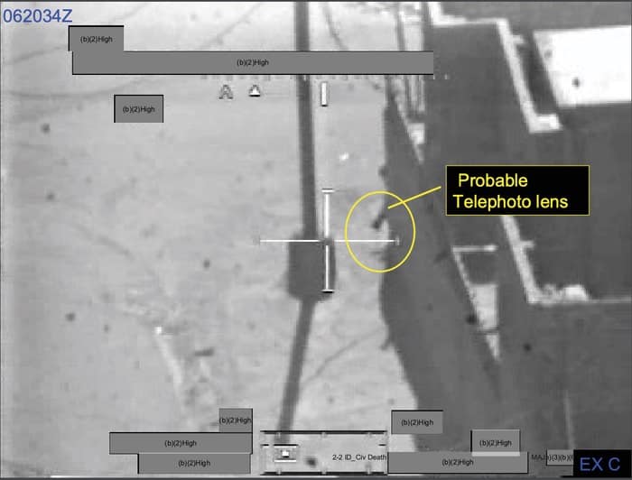 018 - 1EarthMedia Exhibit C – 0620:34 Z Still from Apache Gun Camera Film showing cameraman peering around corner of wall at MB 5458 8617.