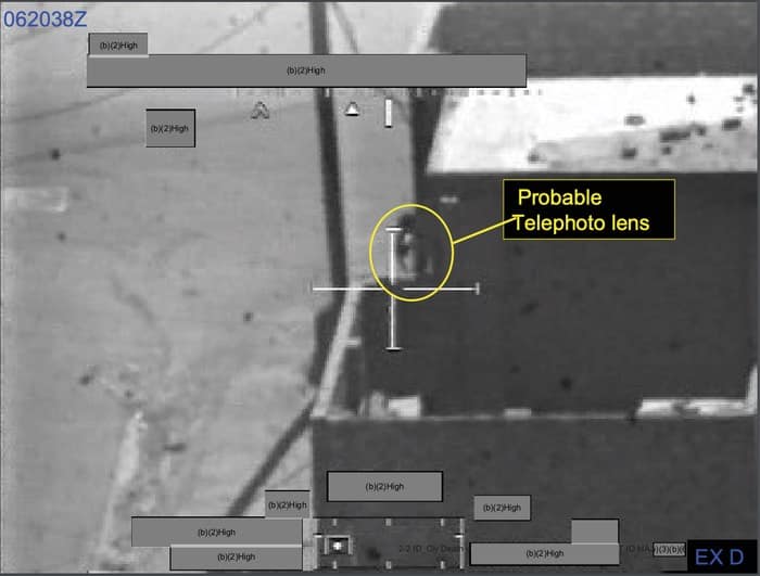 019 - 1EarthMedia Exhibit D – 0620:38 Z Still from Apache Gun Camera Film showing cameraman filming US Army HMMWV.