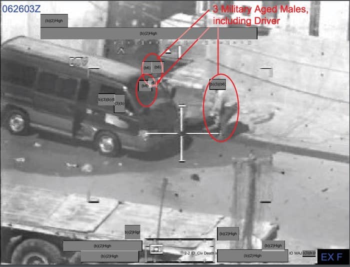 021 - 1EarthMedia Exhibit F – 0626:03 Z Still from Apache Gun Camera Film showing 2 Males attempting to load wounded AIF into black van.