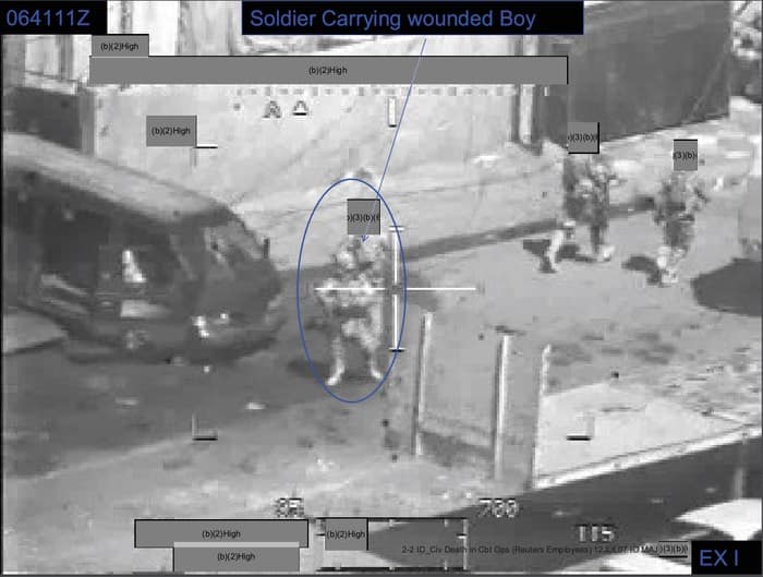 024 - 1EarthMedia Exhibit I – 0641:11 Z Still from Apache Gun Camera Film showing Evacuation of Iraqi boy from black van.